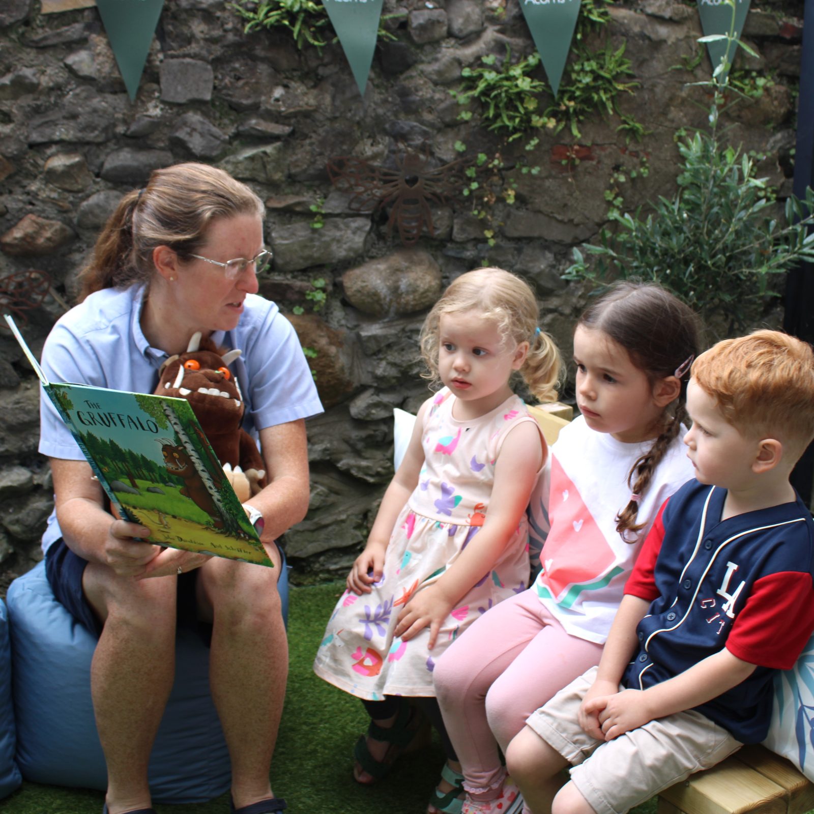 Acorns Nurseries At Acorns House, a woman reads 